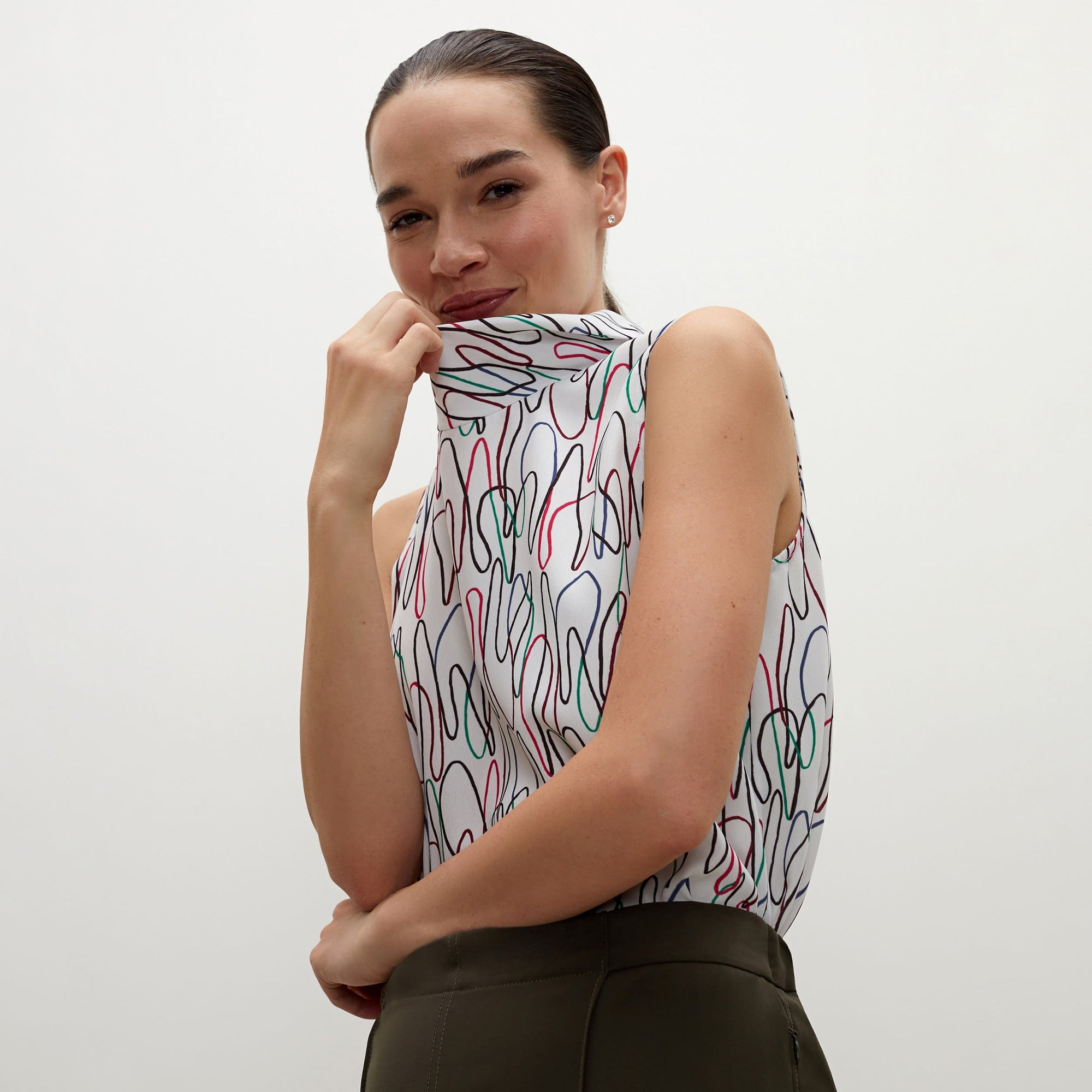 Detail image of a woman standing wearing the Lise top in multicolor