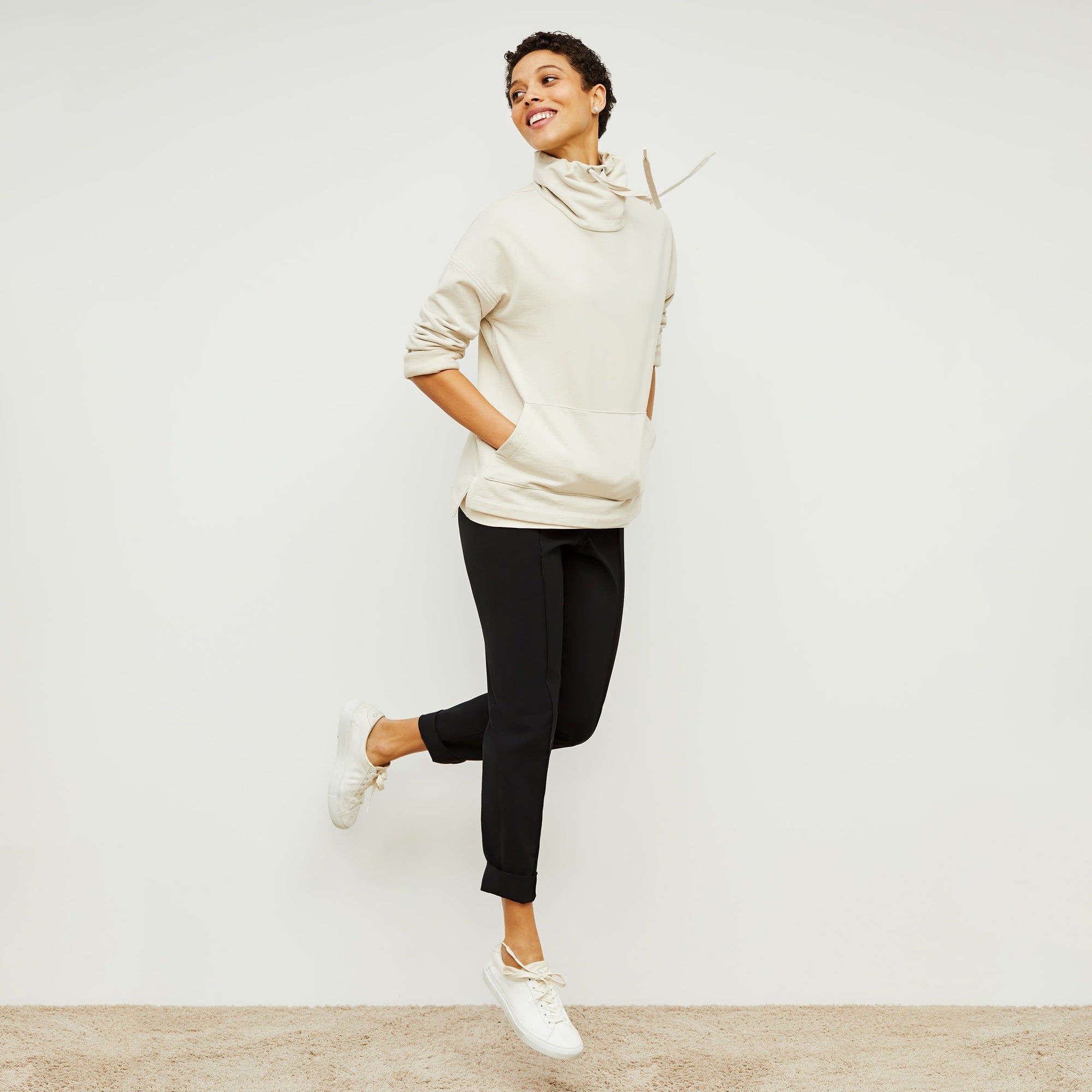 Front image of a woman standing wearing the Colby Jogger in Black | Exclude