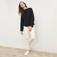 Front image of a woman standing wearing the foster pant in bone