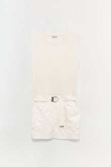 Cream ribbed sleeveless top with white cargo shorts and adjustable belt.