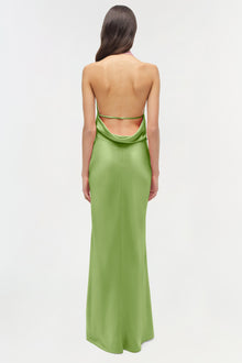 Lime green satin gown with open back and draped neckline, shown from rear view.