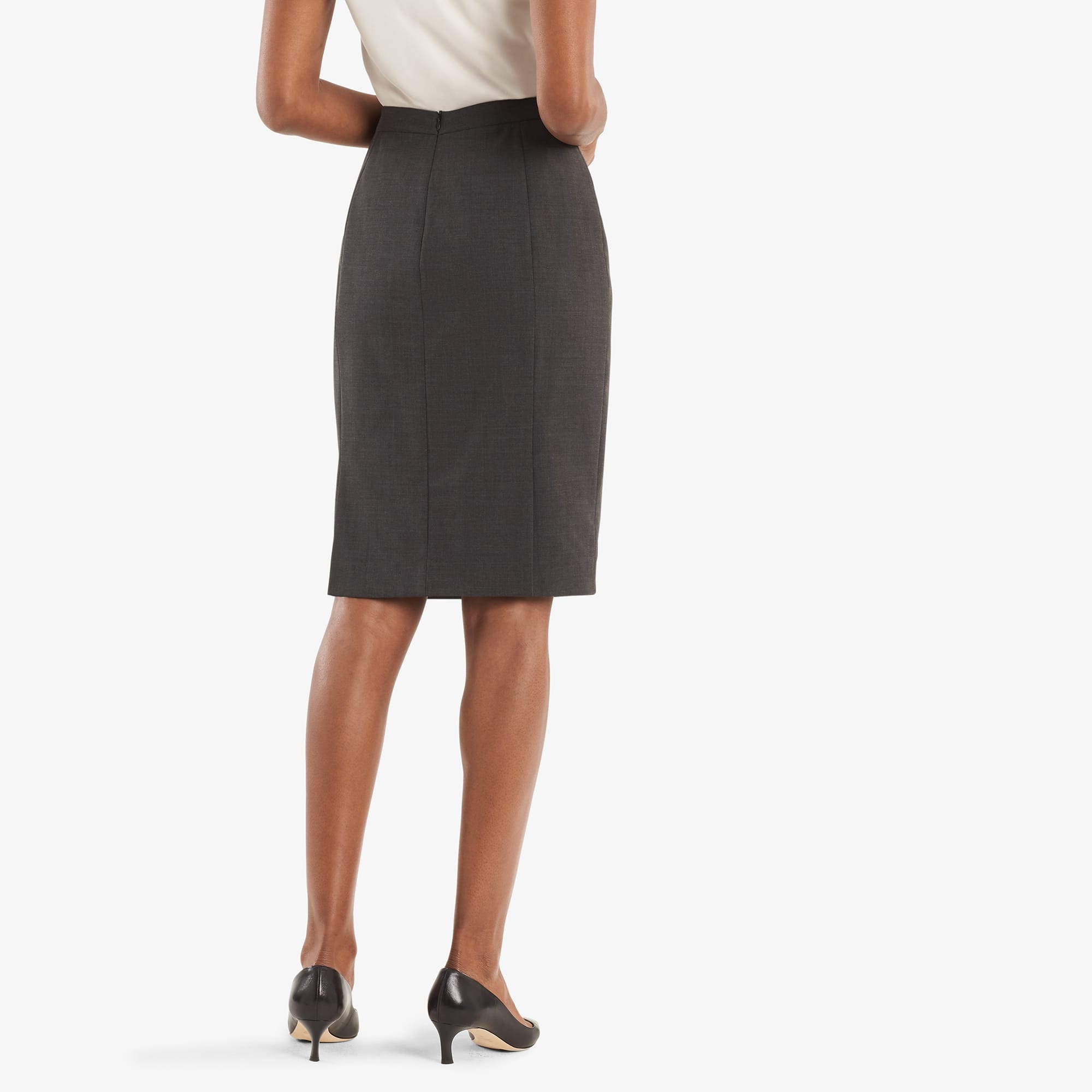 Back image of a woman standing wearing the Cobble Hill skirt in gray melange. | Exclude