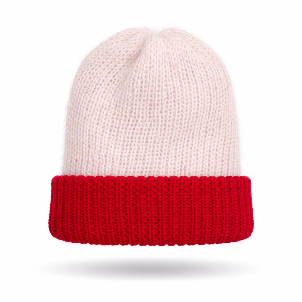 Knitted beanie with white top and red band on a white background