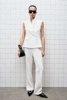 White straight leg trouser with full-length silhouette and flat front waistband.
