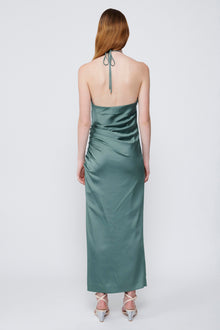 Sage green satin halter gown with draped bodice, open back, and ankle-length skirt.