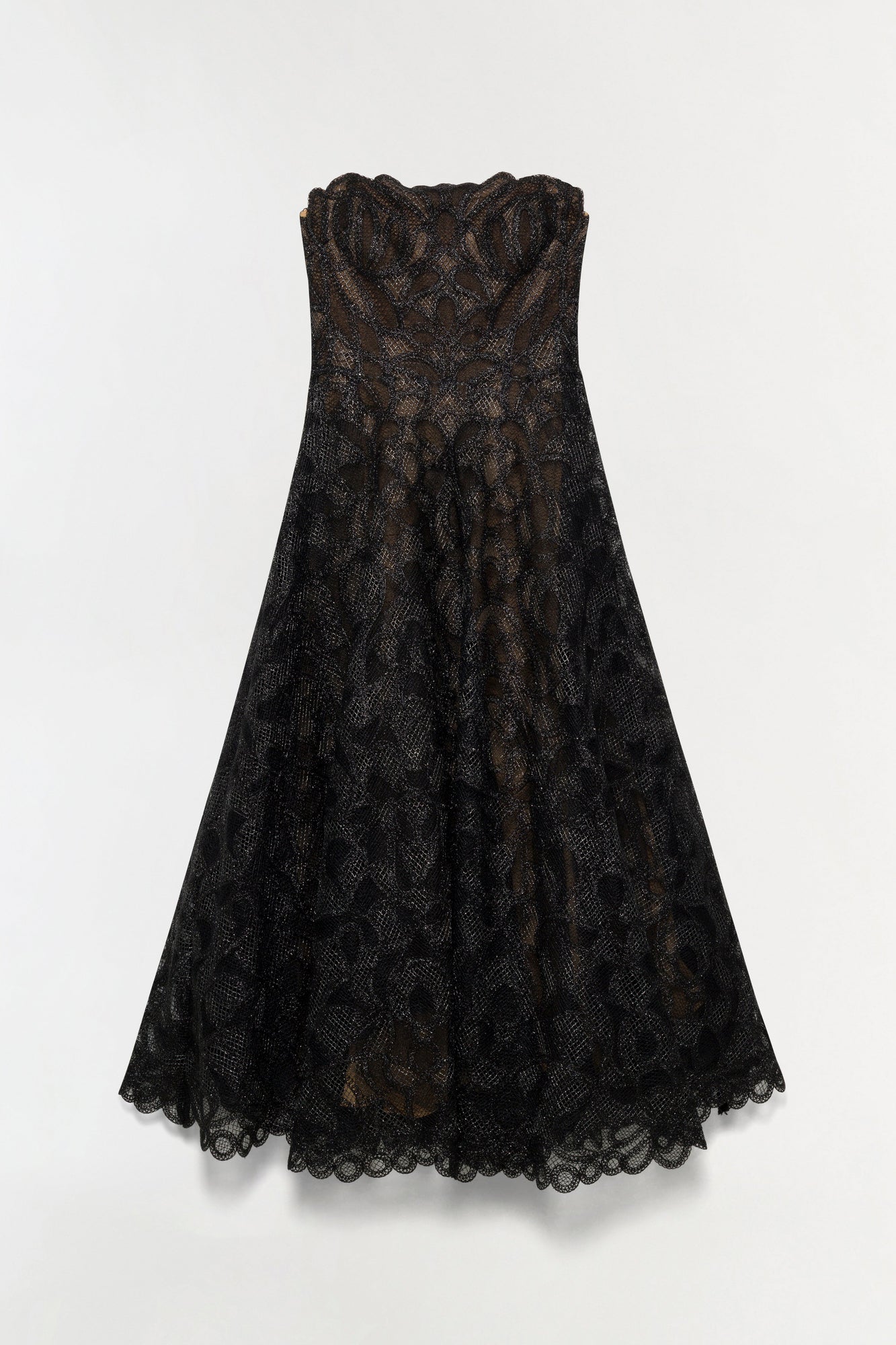 Black lace midi dress with gold-toned geometric pattern, strapless sweetheart neckline, and scalloped lace hem.