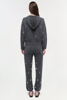 Charcoal cashmere jogger set with scattered crystal embellishments, featuring a hoodie and tapered pants.