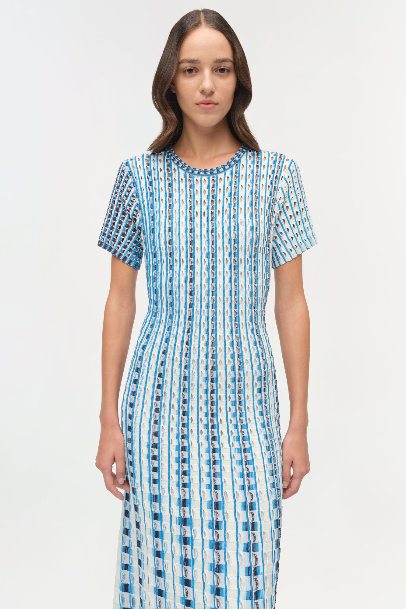 Blue and white striped knit midi dress with short sleeves and textured eyelet pattern throughout.