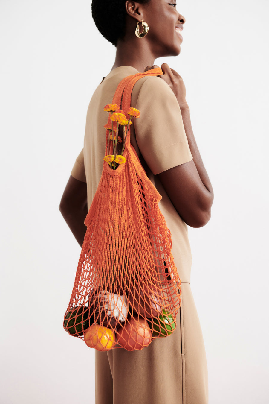 front image of a woman wearing the annika top in saddle | Exclude