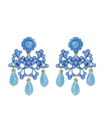 Blue floral earrings with teardrop-shaped beads on a white background