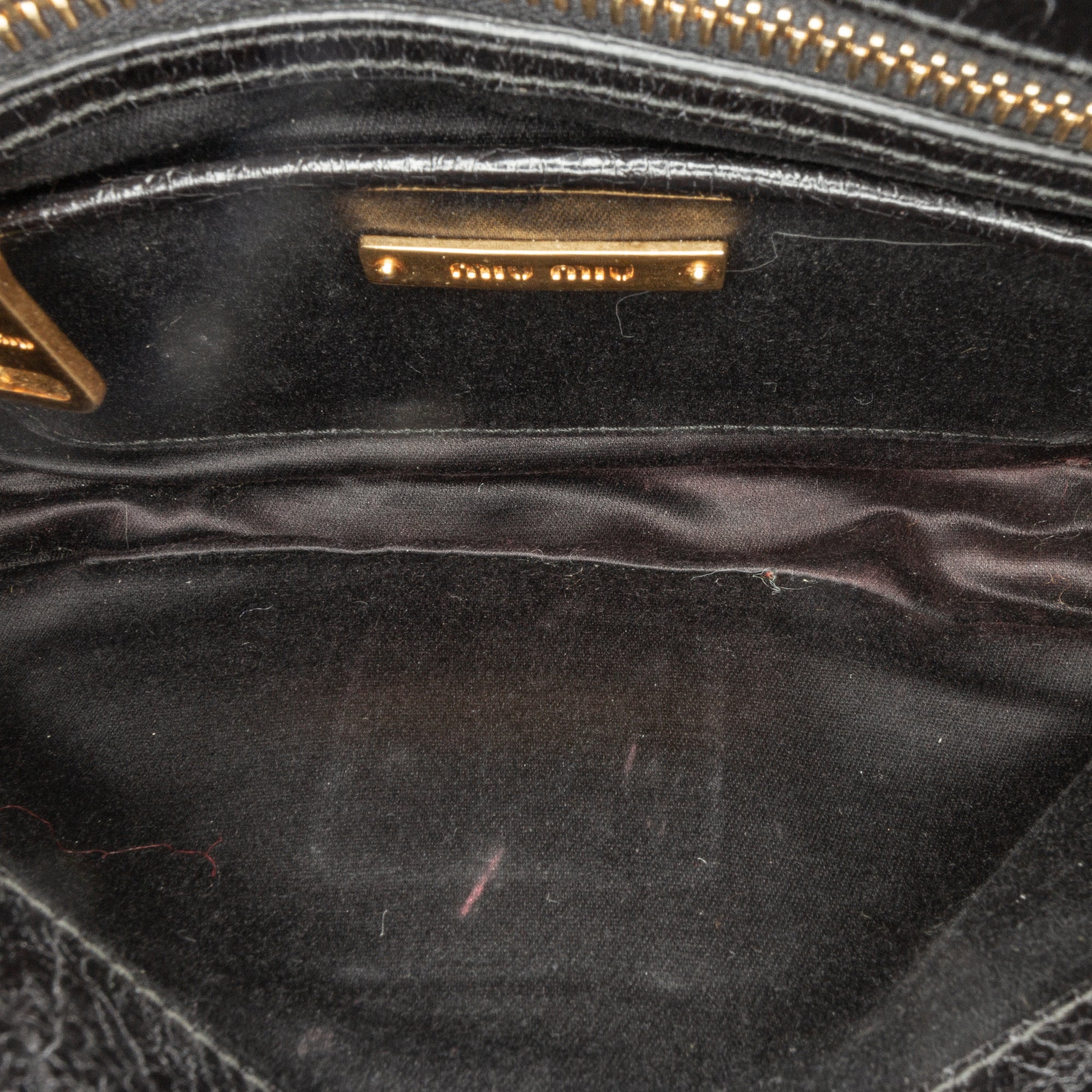 Miu Miu | Pre-Owned Vitello Shine Trapu Clutch | Black
