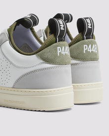 Side angle of white, grey and green sneakers