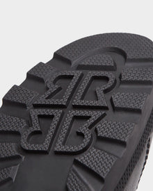 Close-up of the black sole on Rudsaks REAGAN - 6224501 boots, featuring a bold, raised pattern with interlocking BR letters and textured treads for top grip—ideal for men’s winter footwear.