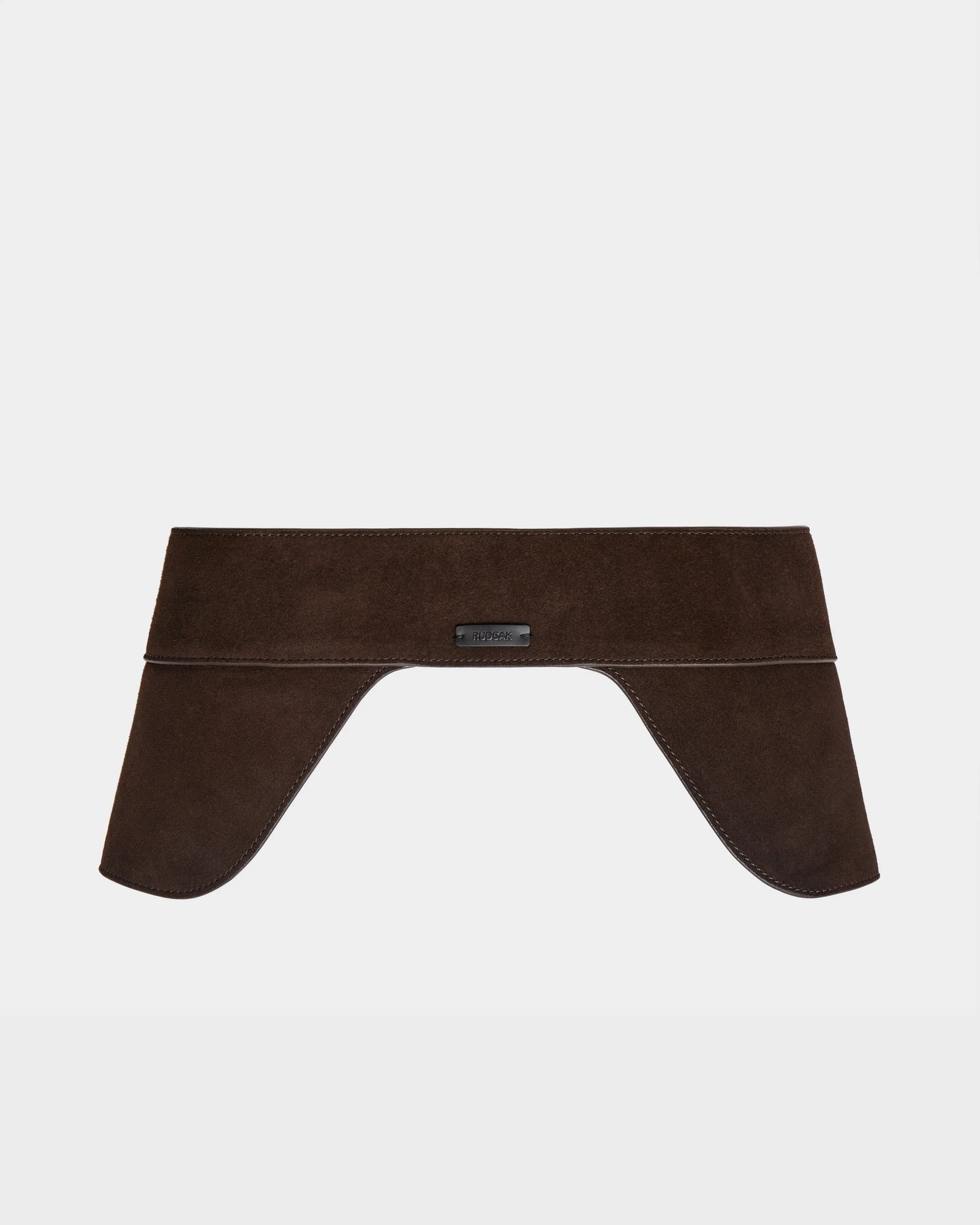 The Rudsak SIMONA S - 8424523 Espresso is a women’s wide brown suede waist belt with a structured saddle side design and two flared ends, elegantly draped and shown against a plain white background.