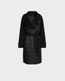 The ZOE - 8124711 Black by Rudsak is a black quilted down trench coat featuring a wide collar, long sleeves, and a matching fabric belt at the waist, shown on a plain light gray background.