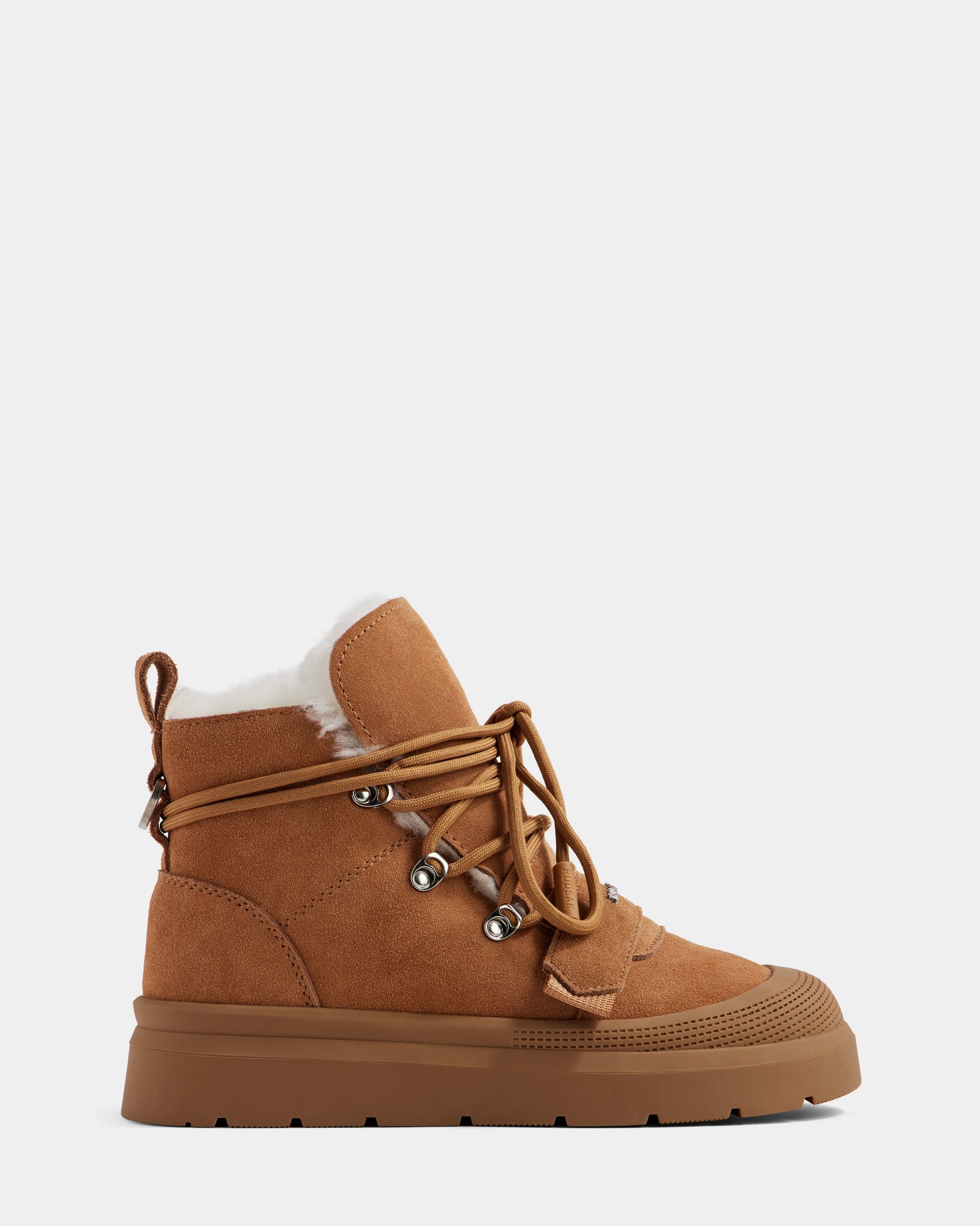 The Rudsak ALEXEY - L225025 Tan women's suede winter boot features a thick rubber sole, metal eyelets, tan ankle laces, and visible wool lining at the top, shown against a plain light background.
