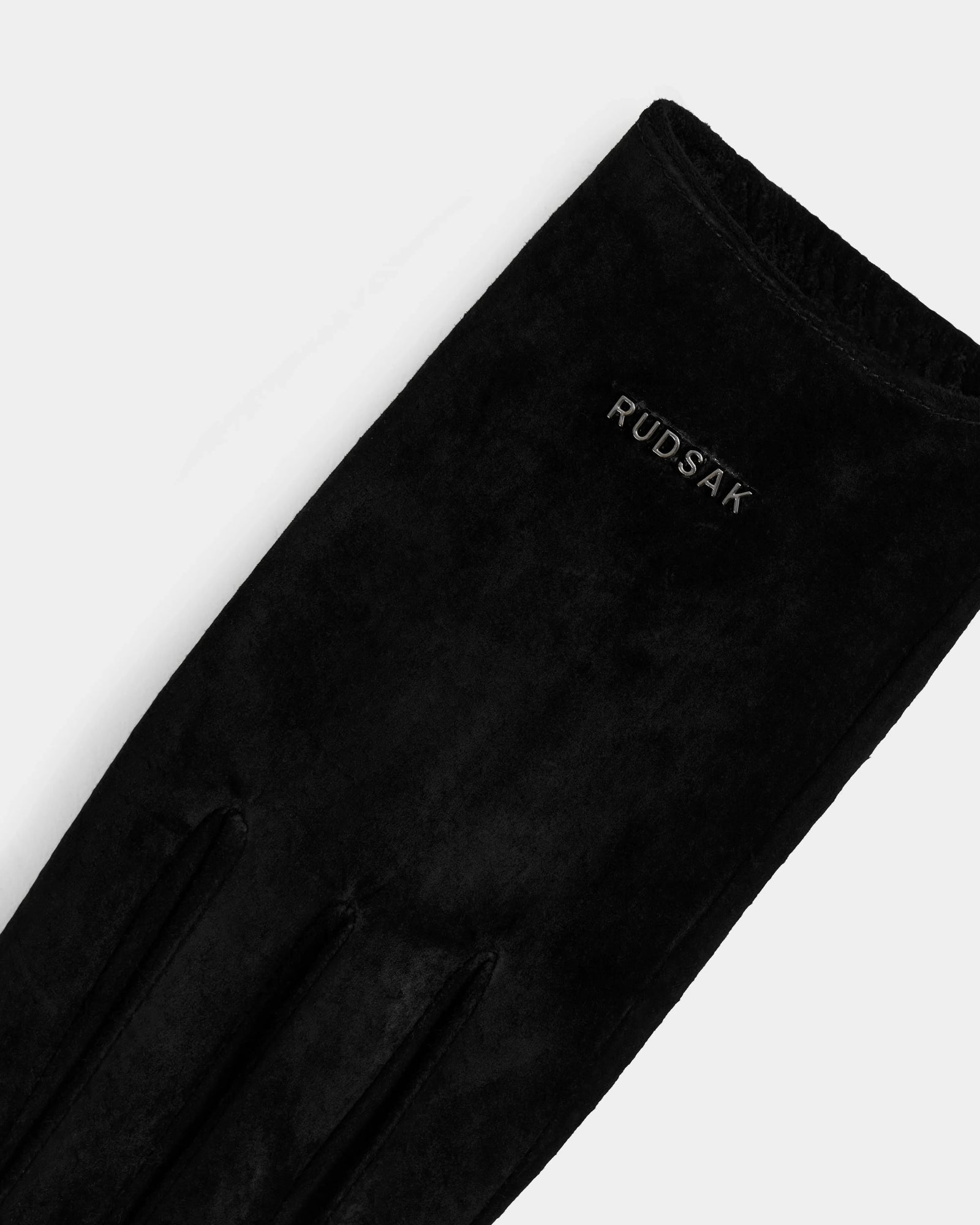 A close-up of Rudsak's FLORA - L425542 Black women’s glove, crafted from suede-like material with the brand logo near the wrist and featuring a warm wool-cashmere lining—perfect for winter.