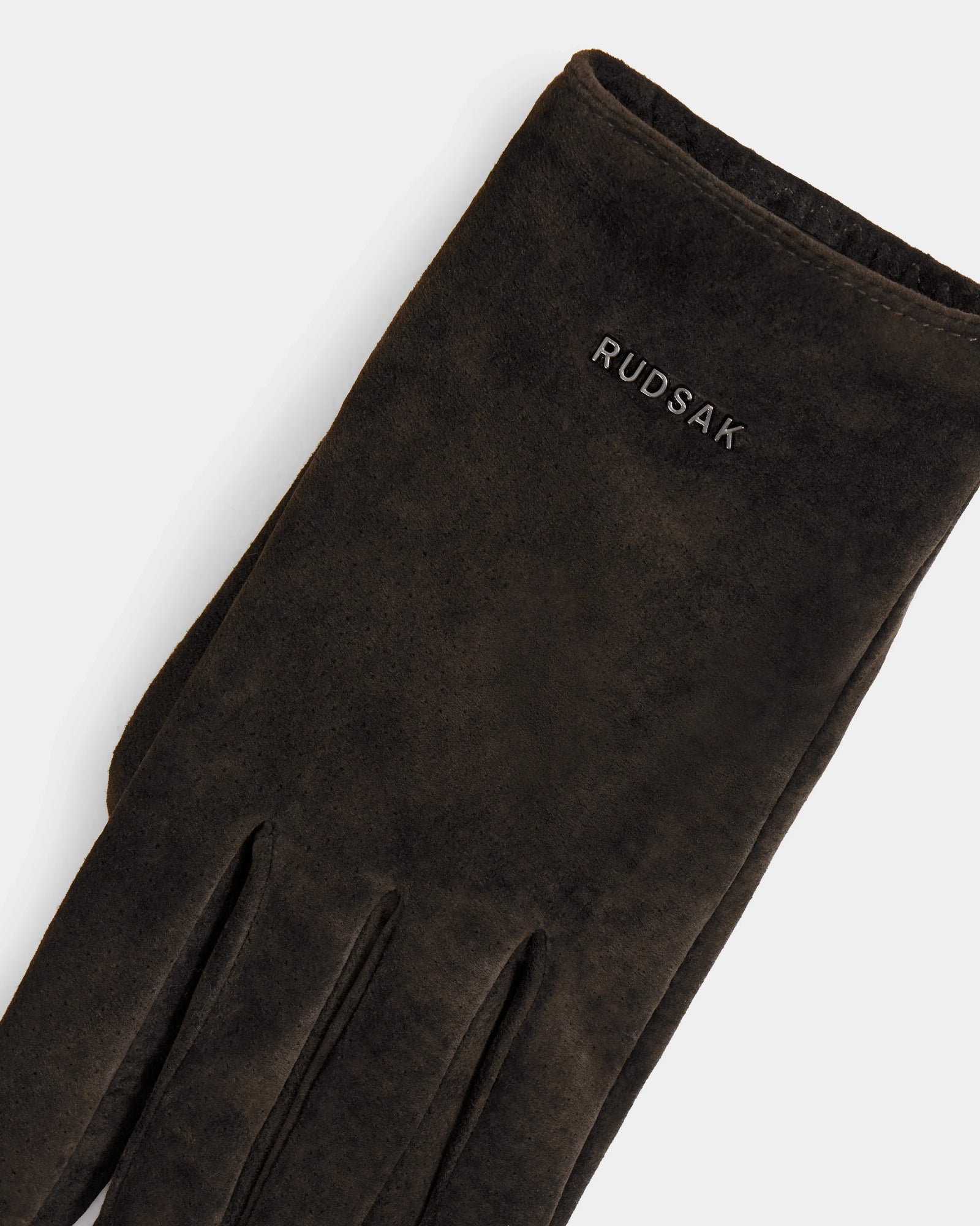 A close-up of Rudsak’s FLORA - L425542 Espresso women’s dark brown suede glove, wool-cashmere lined for warmth, with "Rudsak" embroidered in white near the wrist on a light background.