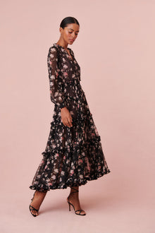 Maxi dress with long blouson sleeves, a v-neck, and shirred tiers at the skirt