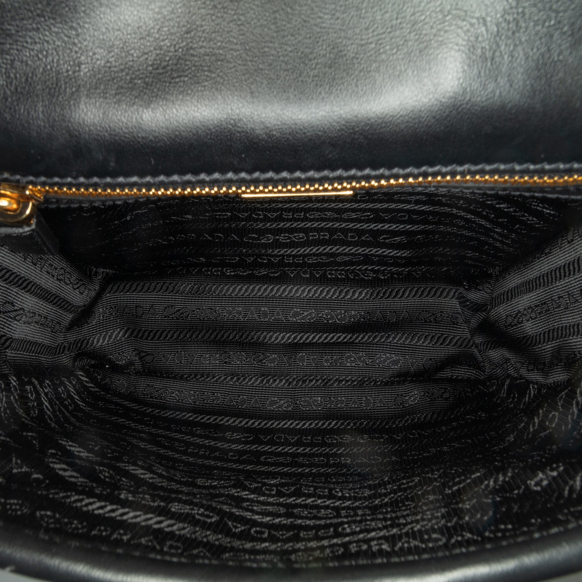 Prada | Pre-Owned Symbole Double Buckle Messenger Bag | Brown