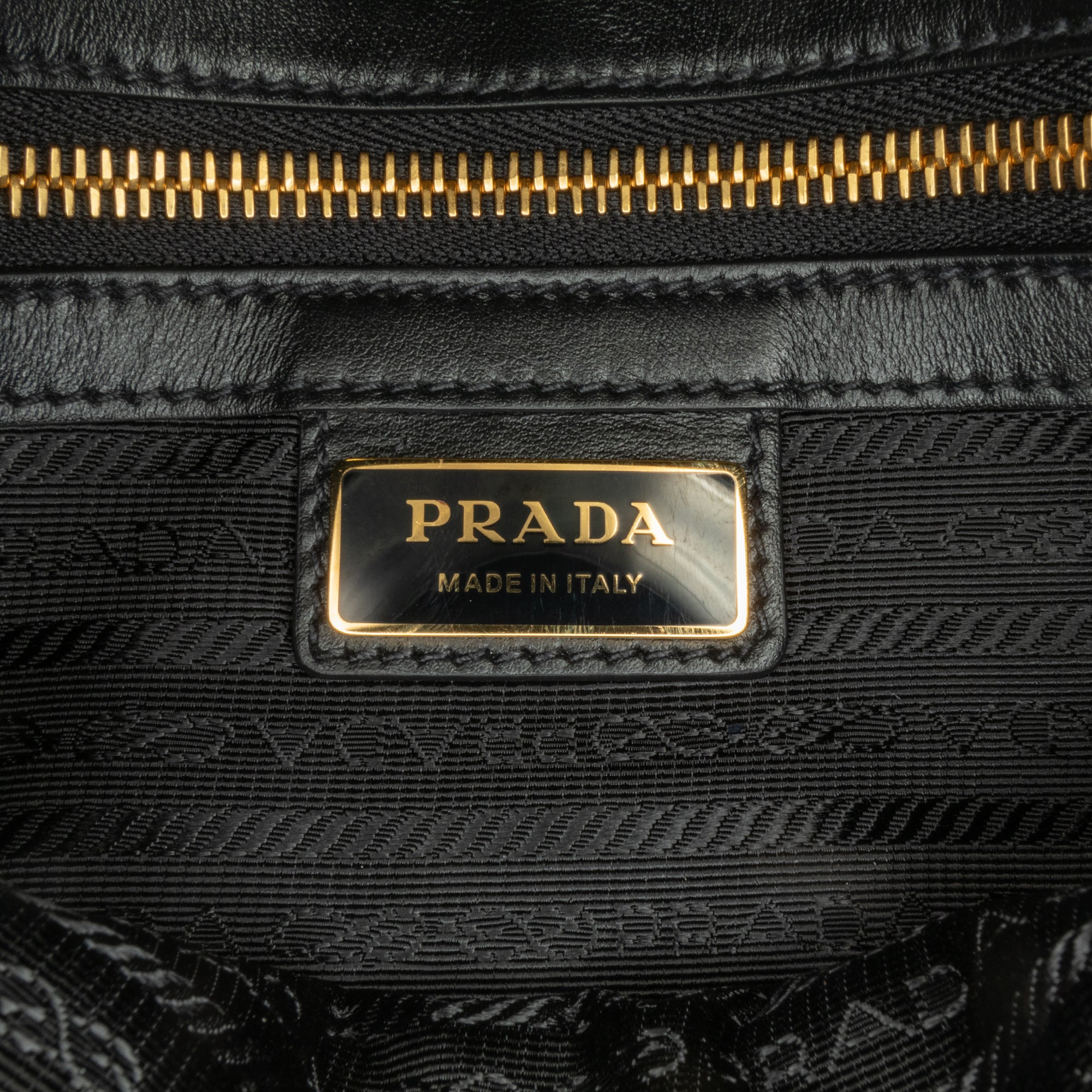 Prada | Pre-Owned Symbole Double Buckle Messenger Bag | Brown