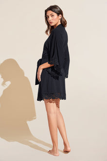 Model wears Naya TENCEL Modal Robe in Black.