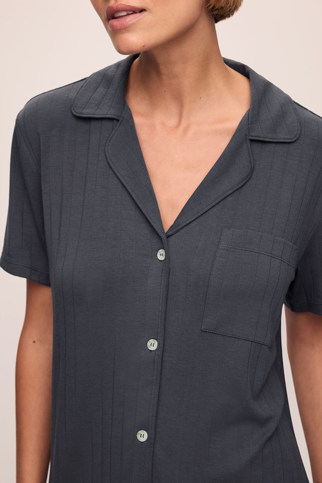 Model wears Gisele TENCEL Modal Rib Relaxed Short PJ Set in Graphite.