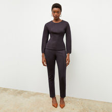 Front image of a woman wearing the rashida top in navy multi