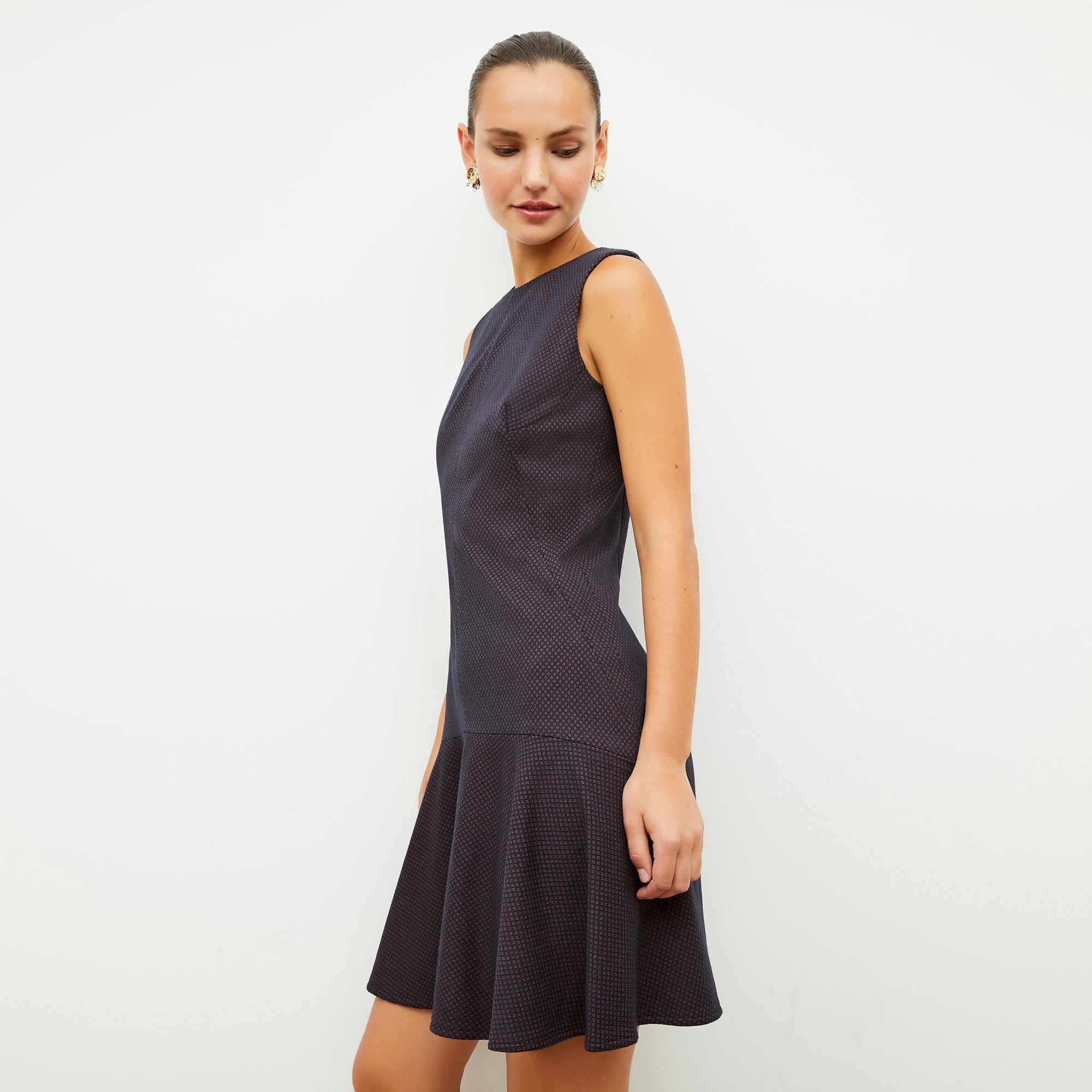 Front image of a woman wearing the jayde dress in navy multi
