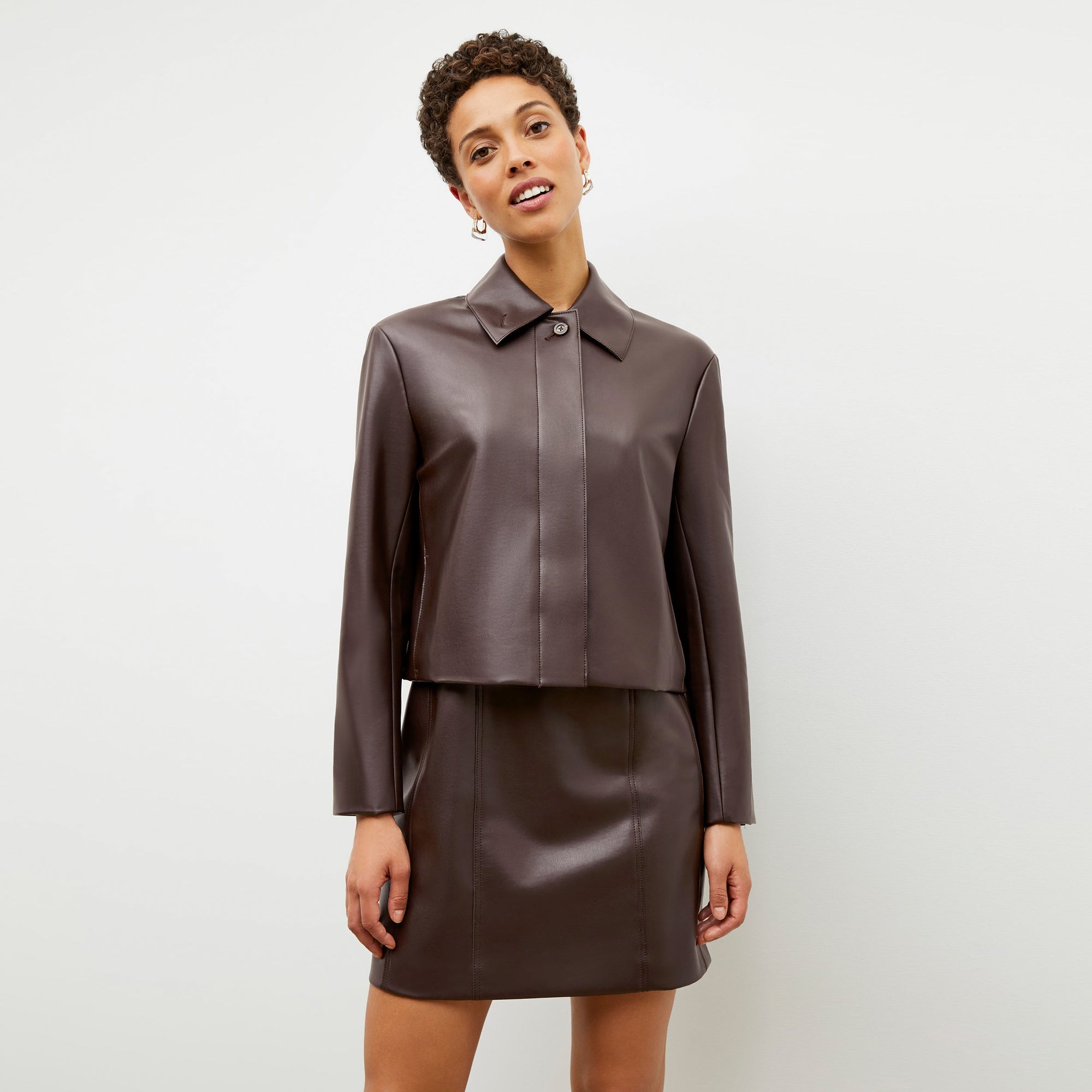 Front image of a woman wearing the nicky jacket in brown