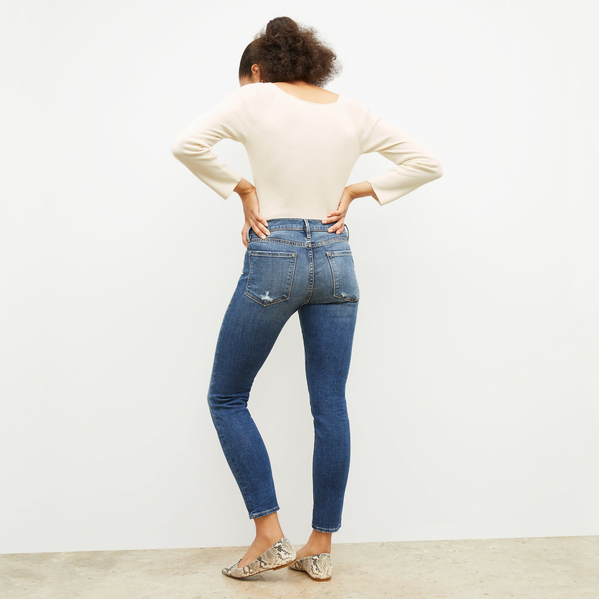 back image of a woman wearing the Joya Top in Cream | Exclude