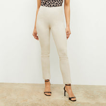 Front image of a woman standing wearing the foster pant in bone | Lead