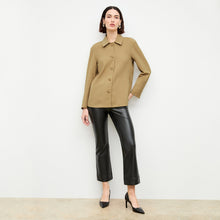 Front image of a woman wearing the archie pant in black