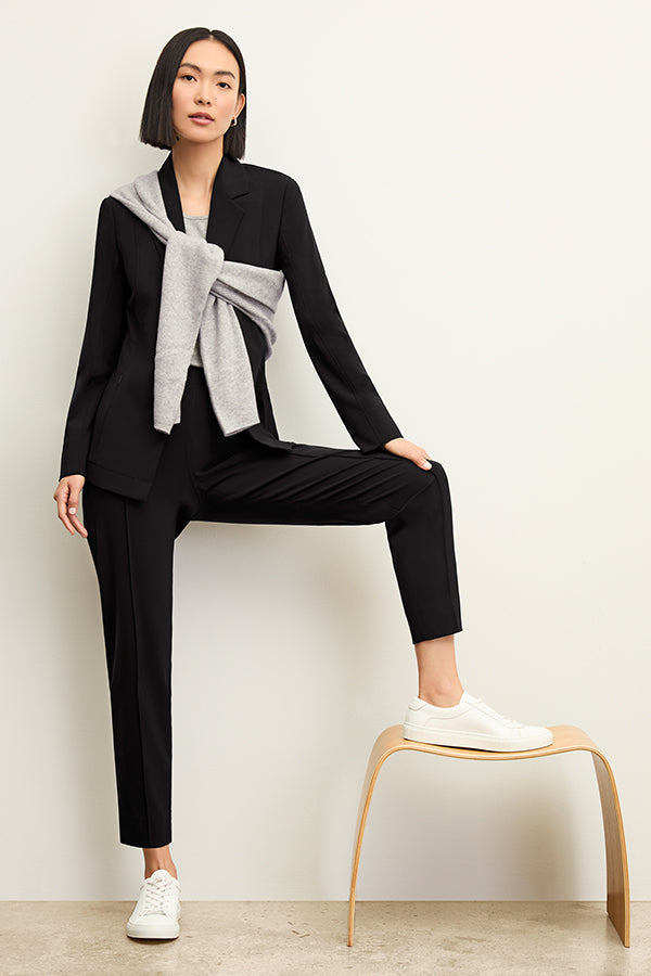 Front image of a woman standing wearing the Colby Jogger in Black | Exclude | Grid Hover