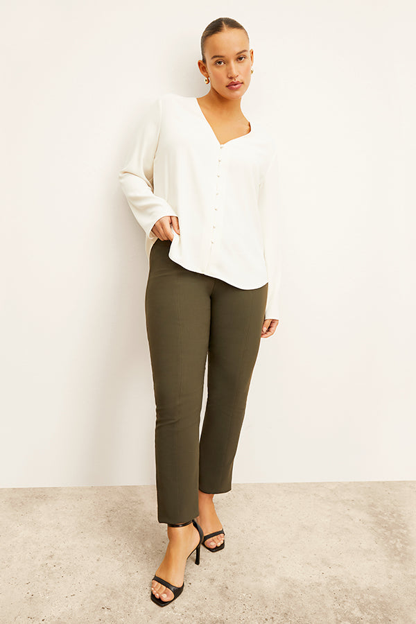 front image of woman wearing foster pant in dark olive | Exclude