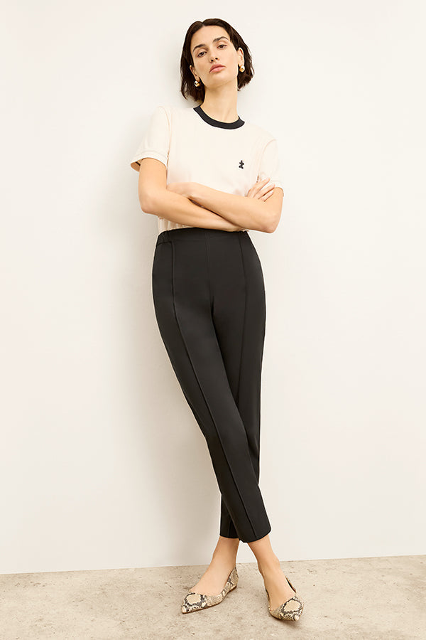Front image of a woman standing wearing the Colby Jogger in Black | Exclude | Grid