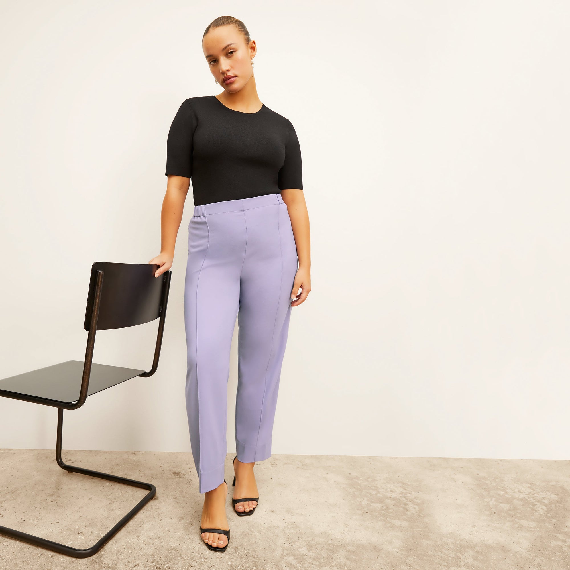 front image of a woman wearing the colby pants in light orchid