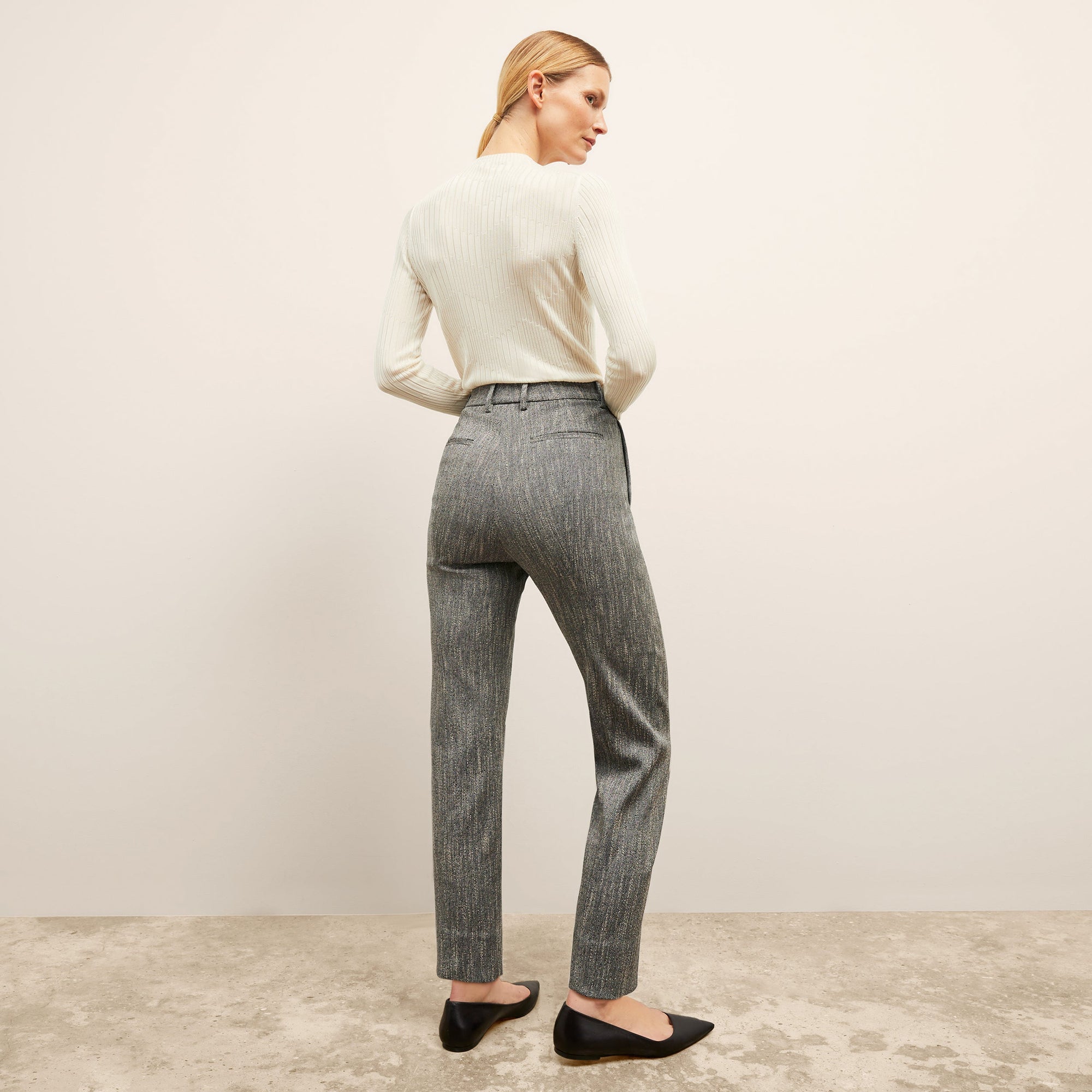 Back image of a woman wearing the brodie top in ivory