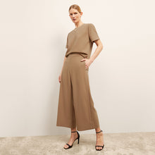 front image of a woman wearing the annika top in saddle