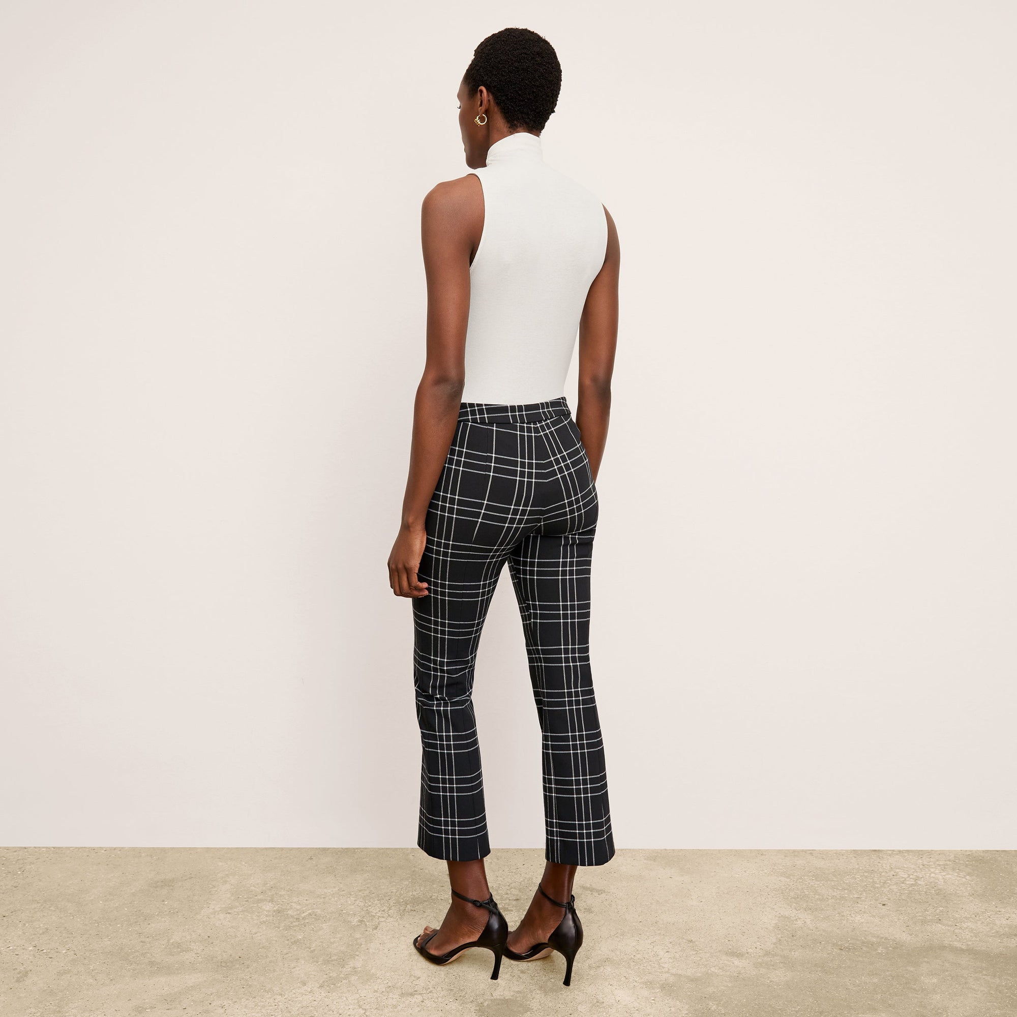 image of a woman wearing the kick flare foster pant in plaid  