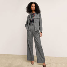 front image of a woman wearing the natalia jacket in black/white