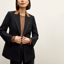 front image of a woman wearing the harley jacket in black/light saddle 