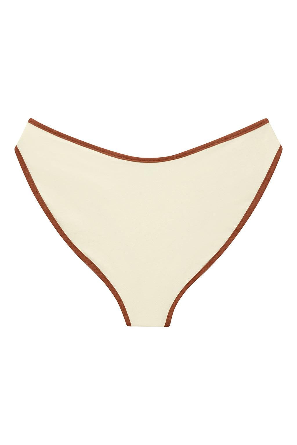 Oat-colored bikini bottom with terracotta-brown binding trim along the neckline and sides.