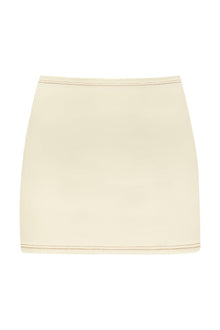 Cream-colored micro skirt with contrasting terracotta binding at waistband and hem.