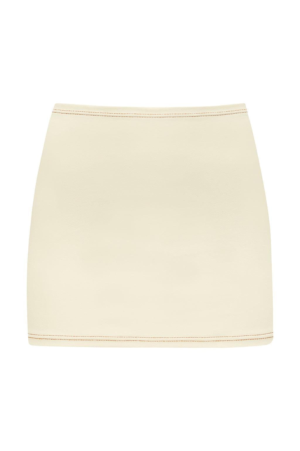 Cream-colored micro skirt with contrasting terracotta binding at waistband and hem.