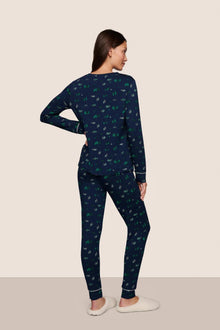Model is wearing Gisele Printed TENCEL Modal Crewneck PJ Set  in Forest Pine Navy/Ivory