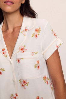 Model is wearing Gisele Printed TENCEL Modal Short Sleeve Cropped PJ Set in  Floral Bloom Ivy/Vanilla Cream