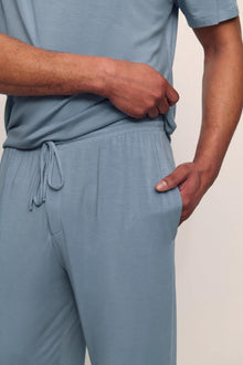 Model is wearing Henry TENCEL Modal Short Sleeve Pant PJ Set in Faded Denim