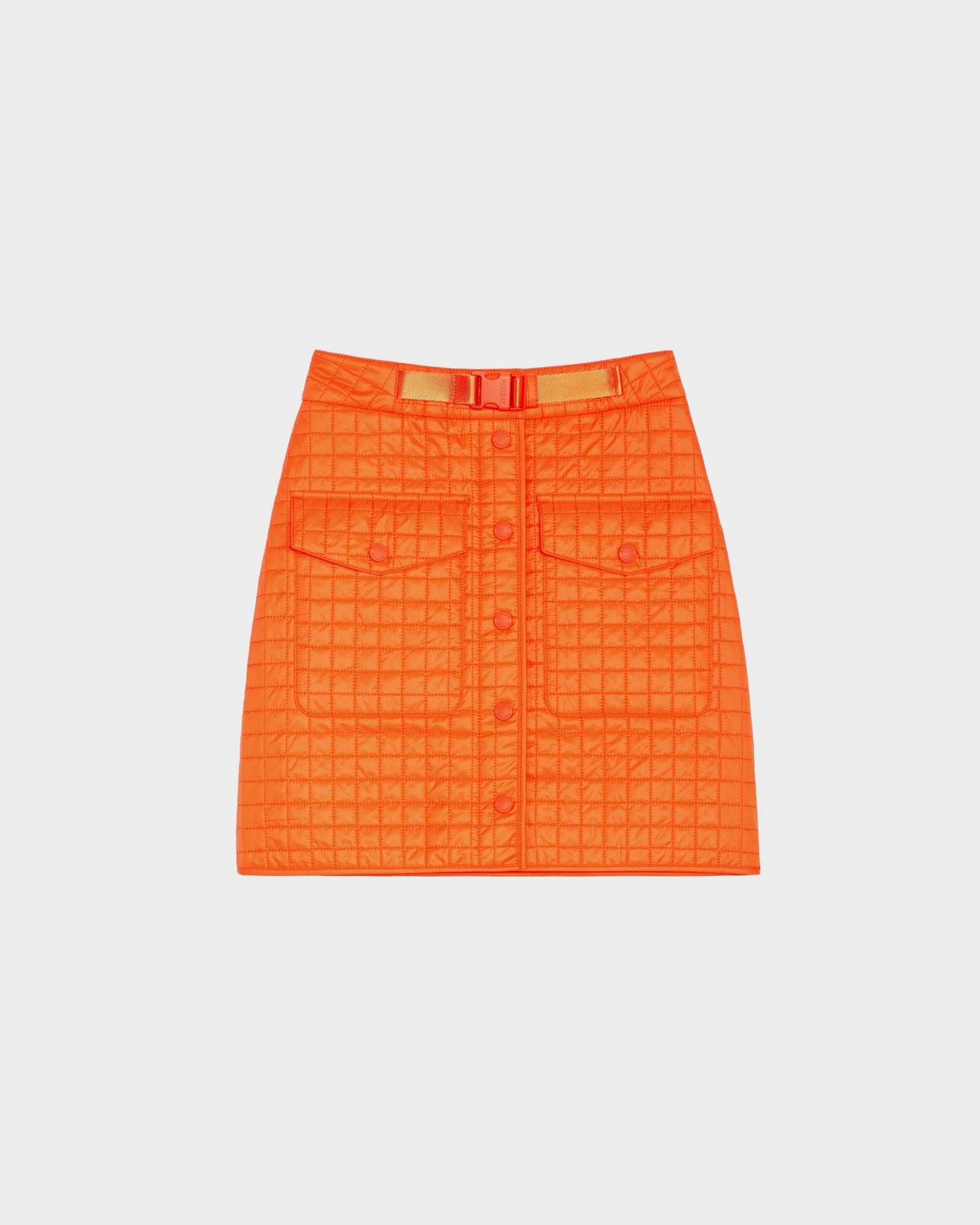The SABINE - 8524063 Orange Sorbet quilted short skirt from Rudsak features front buttons, two flap pockets, and a matching belt for a bold statement against a plain white background.