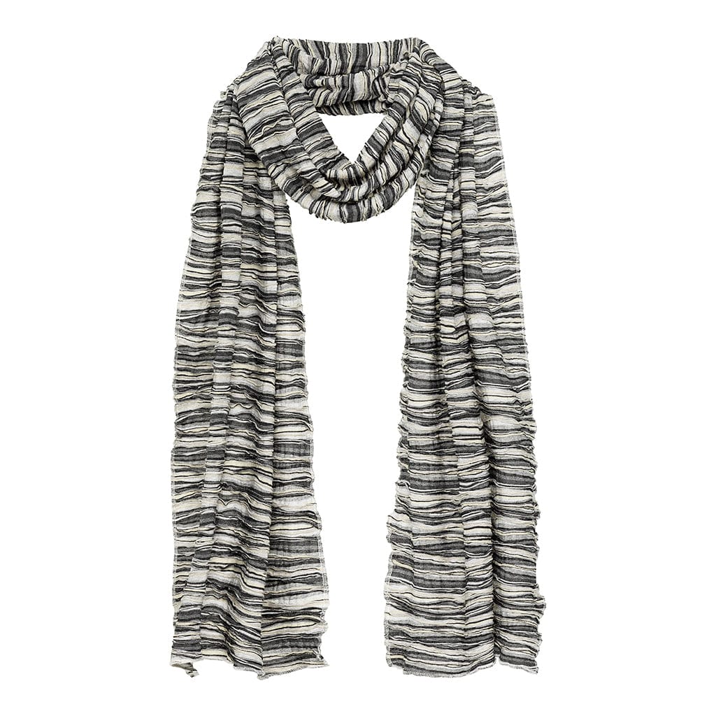 Black and white striped knit scarf with textured slub weave draped loosely around neck.